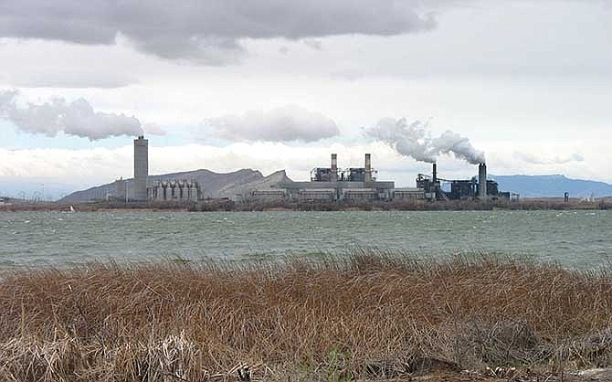 This April 2006, file photo shows The Four Corners Power Plant near the San Juan River in northwestern New Mexico. While the nearby San Juan Generating Station will factor into New Mexico's proposed goal to reduce carbon dioxide emissions by one-third, the Four Corners Power Plant - which is located within the Navajo Nation - won't. 