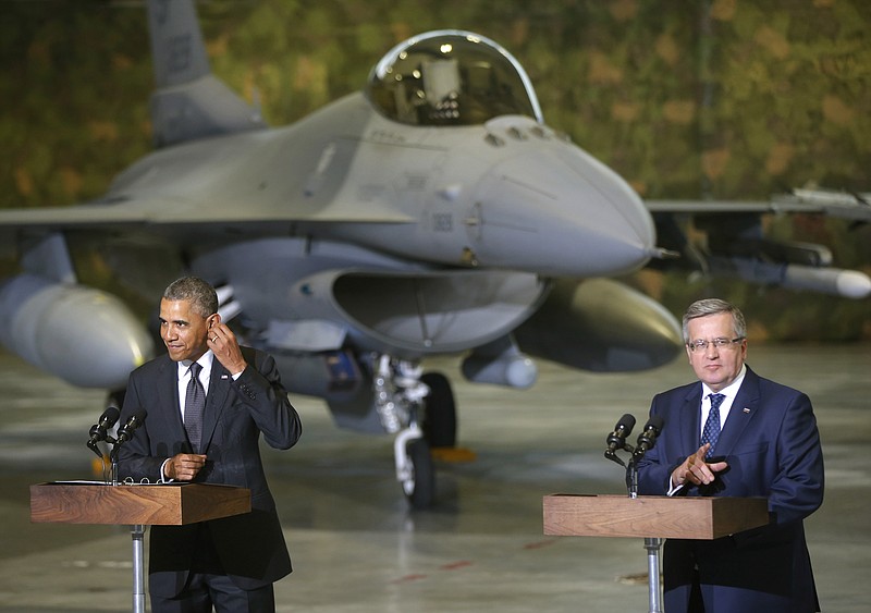 U.S. President Barack Obama and Poland's President Bronislaw Komorowski make statements and meet with U.S. and Polish troops at an event featuring four F-16 fighter jets, two American and two Polish, as part of multinational military exercises, in Warsaw, Poland on Tuesday.