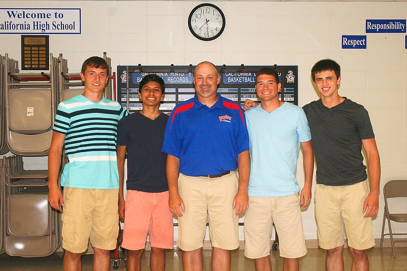 California High School Head Track Coach Rick Edwards, center, with 4x400 Meter Relay team members, from left, Dylan Albertson, Benigno Corona, Conner George and Dylan Norton at the CHS Track and Field Awards Banquet May 27 at the CHS commons. The relay team advanced to the Class 3 state track championships May 30-31. 
