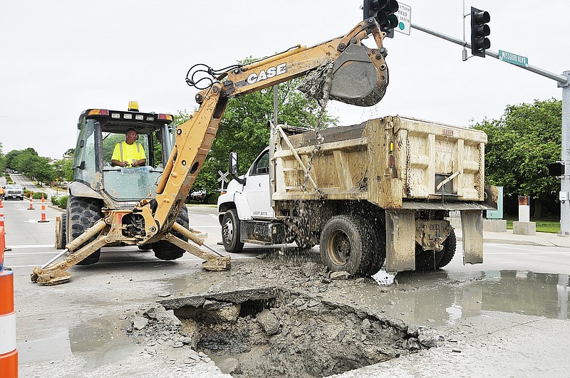 A water main break under W. Main Street at Missouri Boulevard left several Mill bottom buildings without water. Crews will be on the scene until the main is reconnected and the hole refilled and covered.