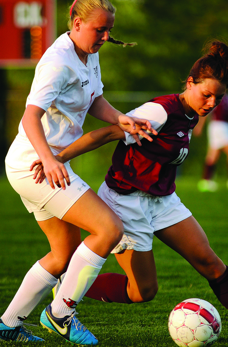 Jefferson City midfielder Tayler LePage battles with Meggy Ross of Rolla for possession of the ball during a game this season at the 179 Soccer Park.