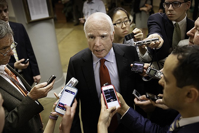 Senate Armed Services Committee member Sen. John McCain, R-Ariz. speaks with reporters on Capitol Hill in Washington about a bill that would give veterans more flexibility to see a private doctor if they are forced to wait too long for an appointment at a Veterans Affairs hospital or clinic.  