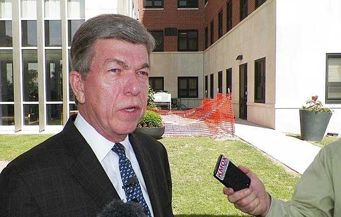 Missouri Republican Sen. Roy Blunt speaks with reporters after meeting with Veterans Affairs officials Wednesday, May 28, 2014 at the St. Louis VA Medical Center.