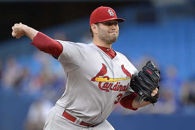 St. Louis Cardinals starting pitcher Lance Lynn throws against the Toronto Blue Jays during the first inning of a baseball game in Toronto on Friday, June 6, 2014. 