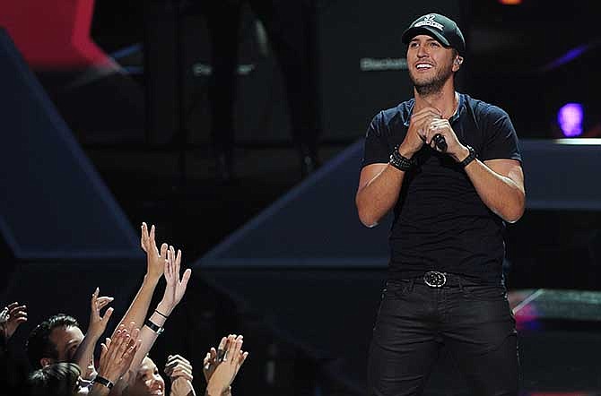 In this May 1, 2014 file photo, Luke Bryan performs at the iHeartRadio Music Awards at the Shrine Auditorium in Los Angeles.