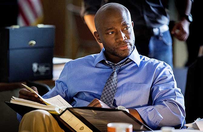 This photo released by TNT shows Taye Diggs in a scene from the pilot for "Murder in the First." Diggs stars as a San Francisco police detective in the drama that also stars Kathleen Robertson and debuts Monday, June 9, 2014. 