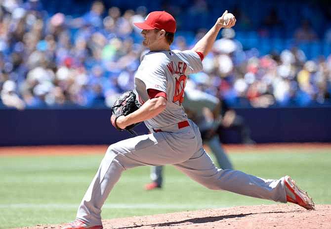 St. Louis Cardinals' pitcher Shelby Miller throws against the Toronto Blue Jays during the first inning of a baseball game in Toronto, Saturday, June 7, 2014. 