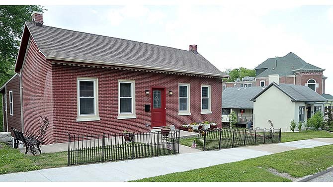 Golden Hammer Award winners, Donna and Michel Deetz renovated houses at 716, 718 and 720 East High Street in Jefferson City. The red brick home above is at 720.