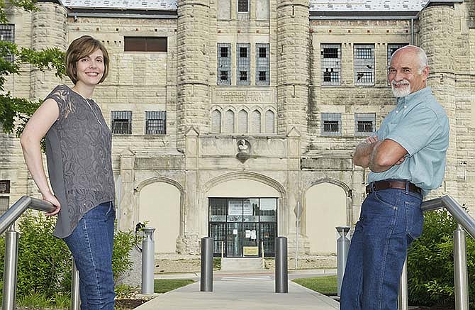 Anita Neal Harrison and her father, Larry E. Neal, pose outside the entrance to the old Missouri State Penitentiary. Larry Neal worked at this location for 20 years and for five years at the new Jefferson City Correctional Center and has co-authored a book about his experiences.