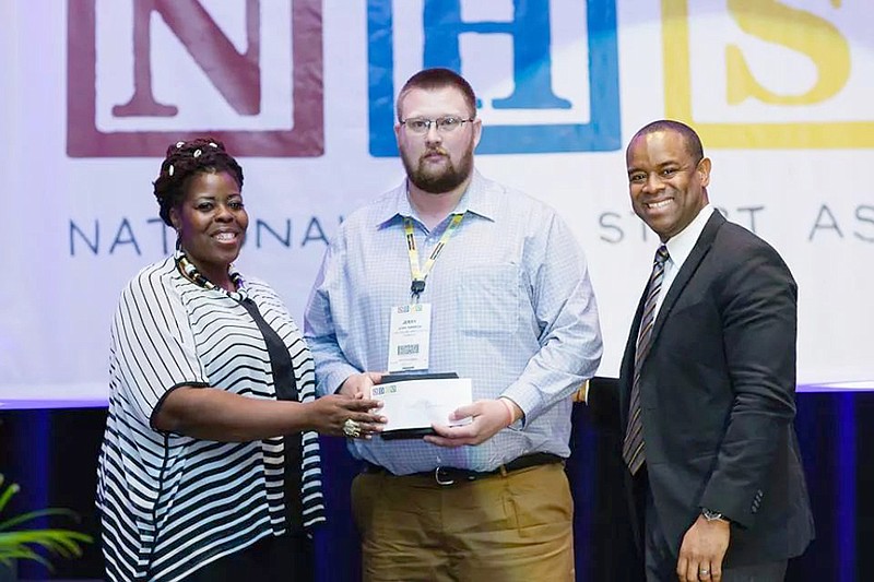 Jerry Damron, center, of Fulton accepts the National Head Start Parent of the Year Award.