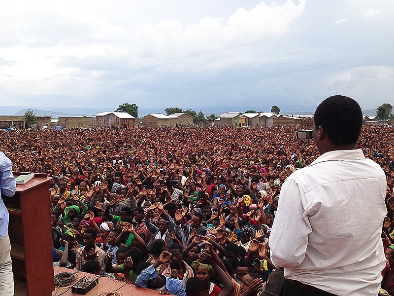 Hands of Ethiopians lifted up in prayer at the crusade in November 2013 in Dore Weyina, Ethiopia. The crusades were held each night of the seven-day mission trip by missionaries of Mission One Eleven, including California's Mike Staton. 