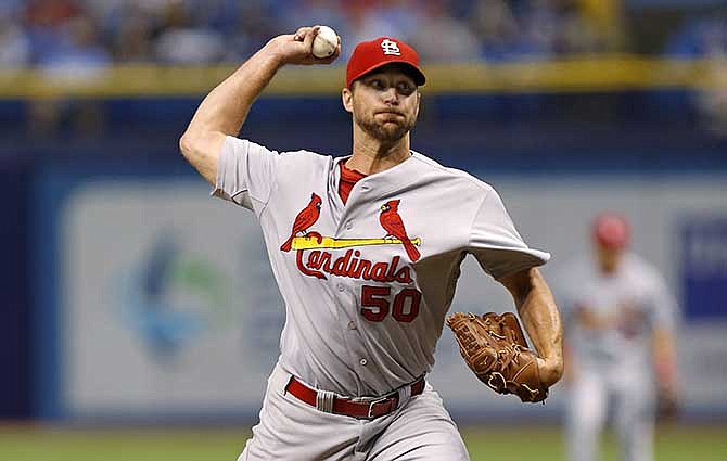 St. Louis Cardinals starting pitcher Adam Wainwright throws during the first inning of a baseball game against the Tampa Bay Rays, Tuesday, June 10, 2014, in St. Petersburg, Fla. 