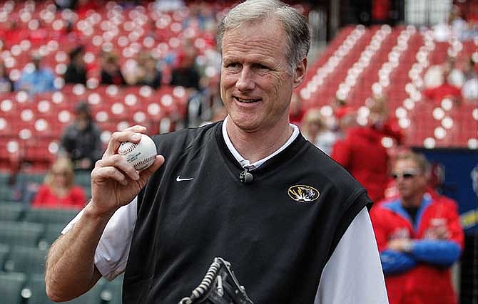 This May 15, 2014 file photo shows University of Missouri-Columbia head basketball coach Kim Anderson preparing to throw the first pitch before a baseball game between the St. Louis Cardinals and the Chicago Cubs  in St. Louis.