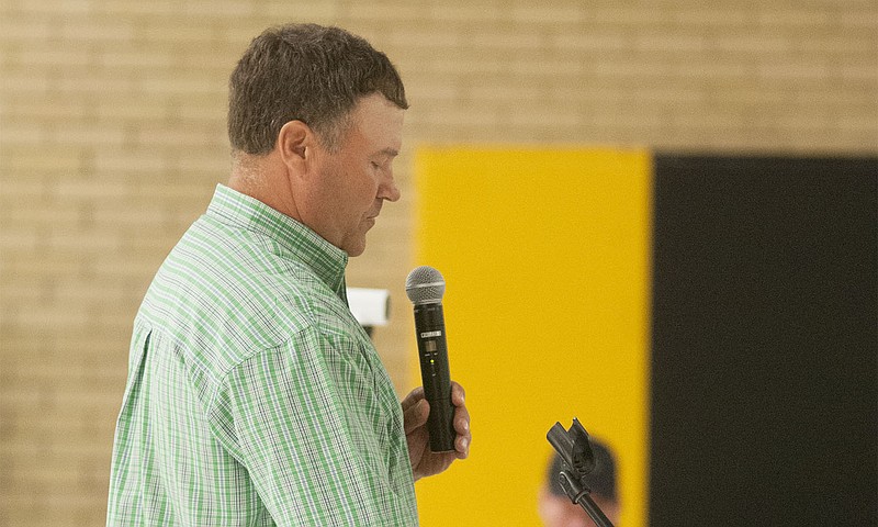 Jeff Jones, a Kingdom City resident and designated spokesperson for a citizen group opposing a potential hog confinement, addresses more than 150 people Tuesday at Hatton-McCredie Elementary to discuss a hog confinement possibly coming to Horstmeier Farms on State Route HH.