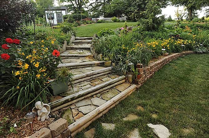 The view from Suzanne and Harry Richter's dining room shows their decades of diligence in their backyard, which is appreciated by bluebirds, butterflies and other natural visitors.