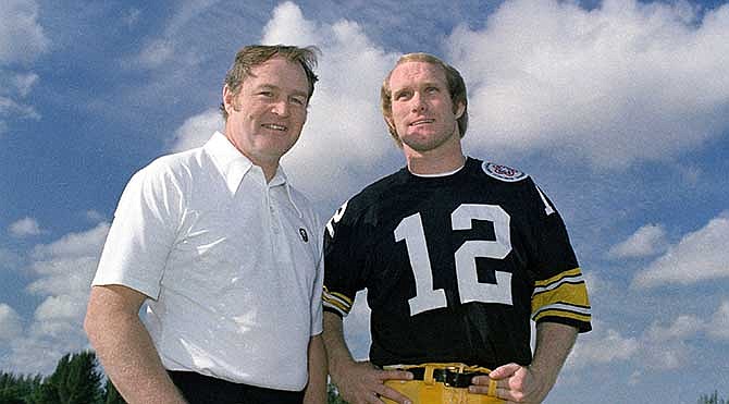 This Dec. 1975, file photo shows Pittsburgh Steelers head coach Chuck Noll, left, and quarterback Terry Bradshaw. Noll, the Hall of Fame coach who won a record four Super Bowl titles with the Pittsburgh Steelers, died Friday, June 13, 2014, at his home. He was 82. The Allegheny County Medical Examiner said Noll died of natural causes.
