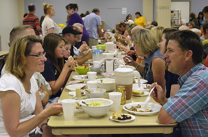 Sunday diners enjoy good food at St. Francis Xavier's annual parish picnic.