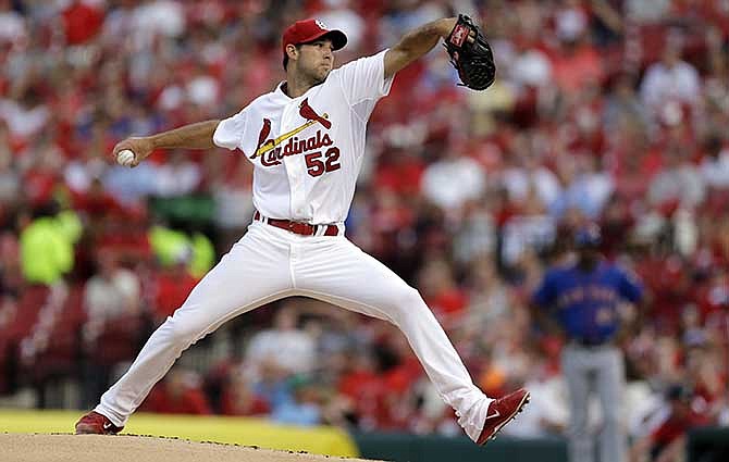 St. Louis Cardinals starting pitcher Michael Wacha throws during the first inning of a baseball game against the New York Mets Tuesday, June 17, 2014, in St. Louis.