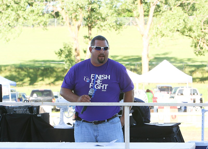Cancer survivor and California Elementary School Principal Daniel Williams shares his inspirational story during the opening ceremony of the American Cancer Society 14th Annual Relay For Life of Moniteau County Friday at the Moniteau County Fairgrounds, California. Williams said, "Abe Lincoln once said 'It's not about how many years you live, but how much living you do in those years.'"
