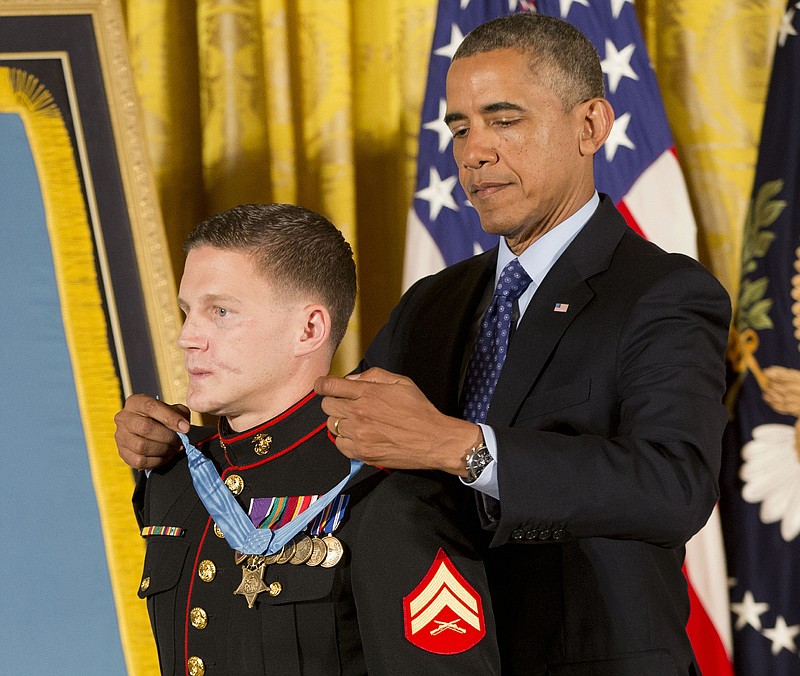 President Barack Obama awards the Medal of Honor to retired Marine Cpl. William "Kyle" Carpenter on Thursday in the East Room of the White House in Washington. 