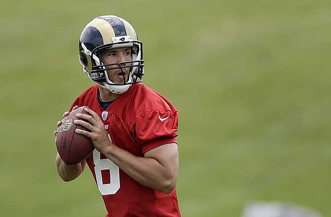 St. Louis Rams quarterback Sam Bradford drops back to pass during the NFL football team's practice on Friday, June 6, 2014, in St. Louis. 