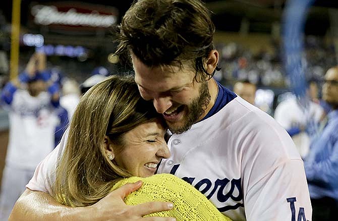 Los Angeles Dodgers starting pitcher Clayton Kershaw celebrates his no hitter with his with Ellen against the Colorado Rockies after a baseball game in Los Angeles, Wednesday, June 18, 2014. 