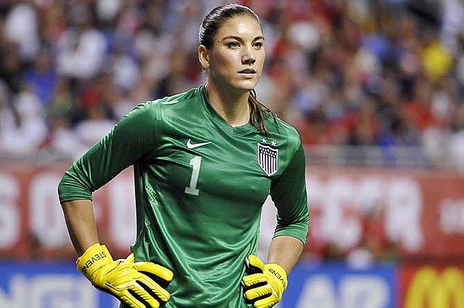 In this Oct. 20, 2013, file photo, United States goalkeeper Hope Solo pauses on the field during the second half of an international friendly women's soccer match against Australia in San Antonio.
