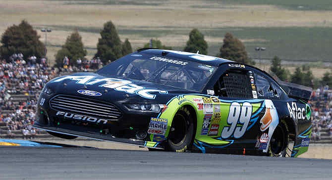 Carl Edwards competes during the NASCAR Sprint Cup Series auto race on Sunday, June 22, 2014, in Sonoma, Calif. Edwards finished first.