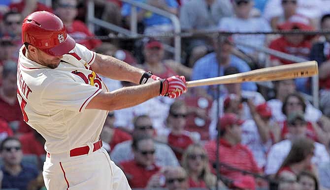 St. Louis Cardinals starting pitcher Adam Wainwright connects for a double in the fifth inning of a baseball game against the Philadelphia Phillies, Saturday, June 21, 2014, in St. Louis.