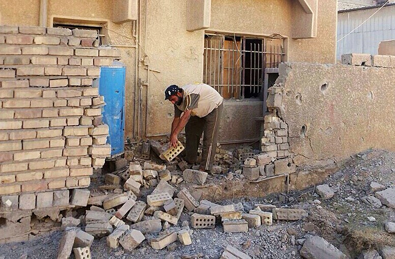 after a bombing in Fallujah, 40 miles west of Baghdad, Iraq.