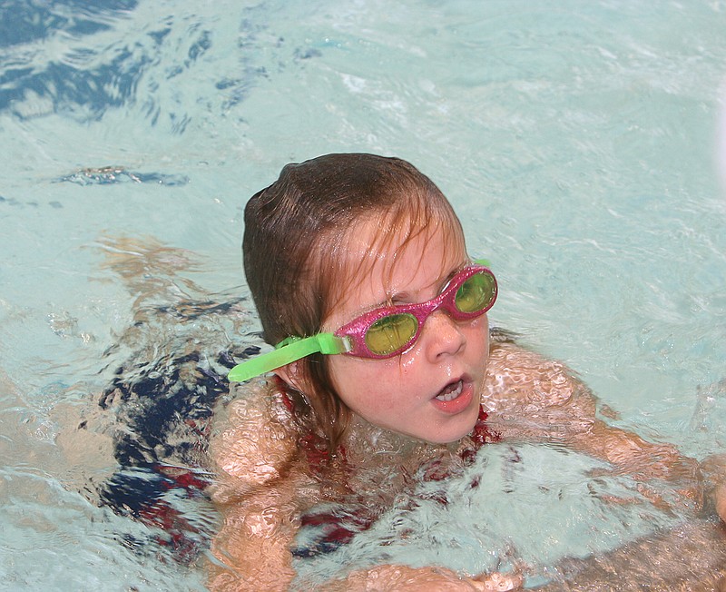 California's Audra Whittle, 6, comes up for air as she finishes the 25 Meter Freestyle event Wednesday at the meet at California.