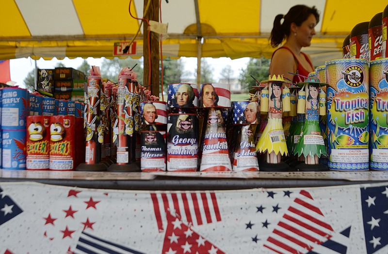 A customer shops in a fireworks stand outside city limits.