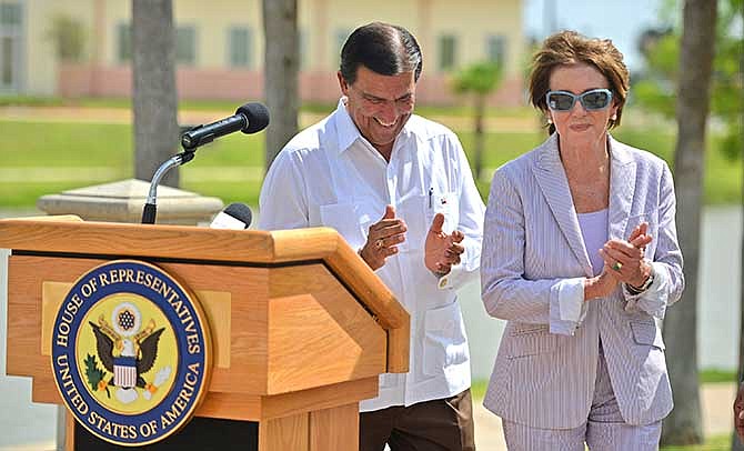 Texas State rep. Eddie Lucio III, left, walks with U.S. House Minority Leader Nancy Pelosi after a news conference on Saturday, June 28, 2014, in Brownsville, Texas. Pelosi said during a visit to the U.S.-Mexico border Saturday that she holds little hope that Congress will pass comprehensive immigration reform this year.