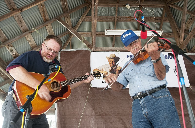 David Lamb of Delight, Ark. and Al Wieberg perform Saturday at the Polly Burre Memorial Old Time Fiddler's Contest. Wieberg and Delight were two of many contestants in the senior division for fiddlers ages 60 and older. There was a also a youth division for fiddlers 15 and younger, and an open division for fiddlers between the ages of 16 and 59.