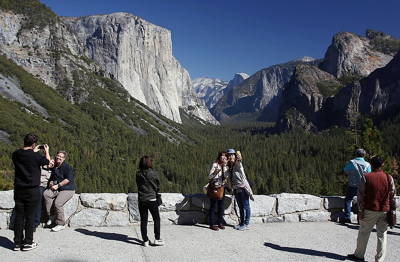 Visitors at Tunnel View enjoy the views of Yosemite National Park, Calif. Tunnel View is a scenic vista which shows off El Capitan, Half Dome and Bridalveil Fall. 