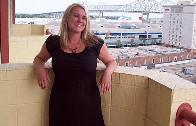 This undated photo provided by the The Cooper Firm on behalf of the Melton family shows Brooke Melton, who was killed in a car crash while driving her Chevrolet Cobalt near Atlanta in March 2010. The Melton family settled a wrongful death lawsuit against General Motors. The family's lawyers now want to reopen the case and show that GM fraudulently concealed a problem with the car's ignition switch.