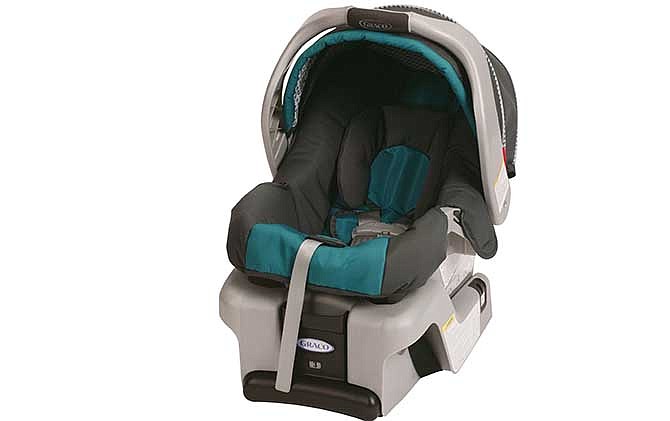 This undated photo provided by Graco Children's Products shows a SnugRide Classic Connect infant car seat. Graco Children's Products is recalling 1.9 million infant car seats, bowing to demands from U.S. safety regulators in what is now the largest seat recall in American history. Buckles can get gummed up by food and drinks, and that could make it hard to remove children. Infant-seat models covered by the recall issued Tuesday, July 1, 2014, include the SnugRide, SnugRide Classic Connect (including Classic Connect 30 and 35), SnugRide 30, SnugRide 35, SnugRide Click Connect 40, and Aprica A30. They were manufactured between July 2010 and May 2013, according to the National Highway Traffic Safety Administration. 