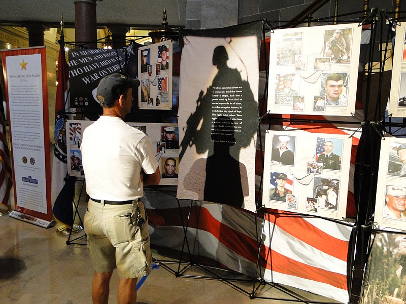 The Missouri Remembering the Fallen memorial, displayed here at its July 2011 unveiling at the Missouri State Capitol in Jefferson City, features the photographs of every Missouri soldier killed in the line of duty in Afghanistan and Iraq since Sept. 11, 2001.