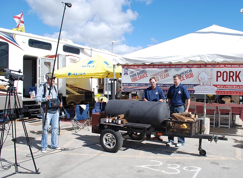 Heath Hall and Brett Thompson film a segment for the television show "The Shark Tank."