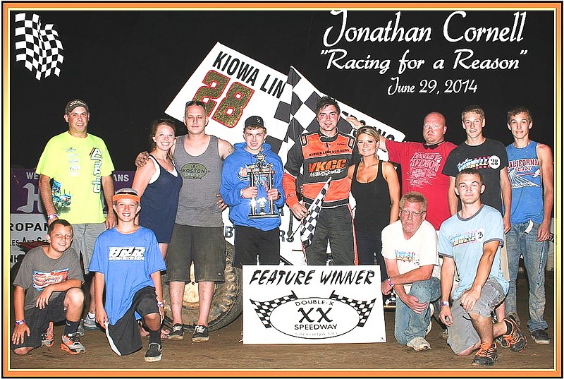 Sedalia's Jonathan Cornell, at center, celebrates winning the 360 Winged Sprint main event at the inaugural "Racing for a Reason-Autism Awareness" with crew members and friends Sunday, June 29, at the Double-X Speedway. Cornell's trophy was presented by Zach Pripusich, Sedalia (shown next to Cornell with trophy).