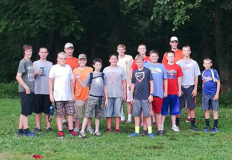Troop 120 takes a break from playing kickball after dinner during summer camp.
