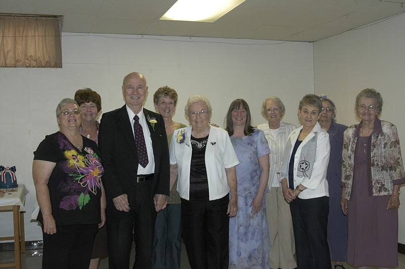 The Rev. Martin Hoyer and Hazel with the Ladies Aid group June 29, at the second retirement. He has presented a monthly Bible study at the Ladies Aid group meetings.