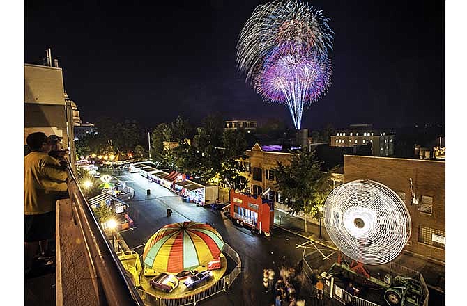 This July 4, 2013, file photo shows the carnival on Capitol Avenue and fireworks near the Capitol during Jefferson City's Salute to America.