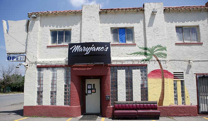 This Wednesday, July 2, 2014 photo shows Maryjane's 420 Shop & Cannabis Social Lounge in Denver. A police raid at the Amsterdam-style cannabis lounge has triggered a debate over where adults can smoke pot in a state that allows recreational marijuana consumption - but not in public. 