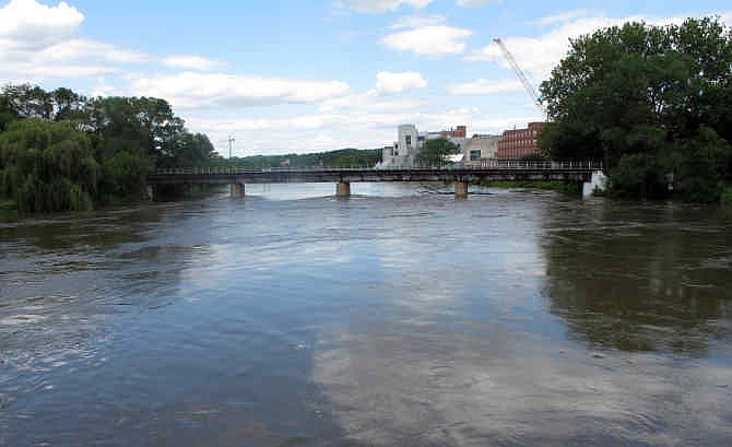 The Iowa River is shown under a bridge in Iowa City, Iowa, near the University of Iowa campus, on Thursday, July 3, 2014. The university is bracing for flooding of the Iowa River after a projection released Thursday warned a key reservoir upstream could come close to breaching its emergency spillway next week. 