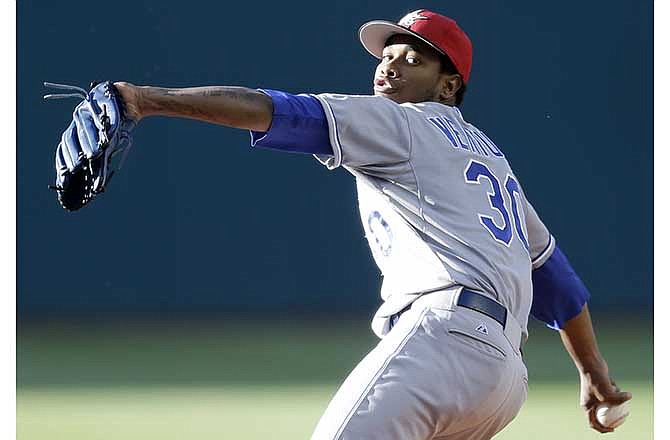 Kansas City Royals starting pitcher Yordano Ventura delivers in the first inning of a baseball game against the Cleveland Indians, Friday, July 4, 2014, in Cleveland.