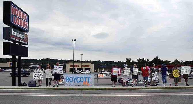 On Saturday, local activists picketed in front of Jefferson City's Hobby Lobby to protest the Supreme Court's Monday ruling in favor of the retailer. The court's decision means Hobby Lobby is not required to cover certain birth control for its employees under the Affordable Care Act. The group protesting consisted of members of the Missouri chapter of the National Organization for Women, as well as other groups and individuals not associated with any organization.