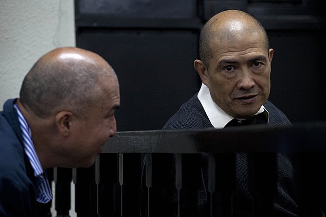 Ex-guerrilla Fermin Felipe Solano Barrillas, right, sits next to a relative during his trial in Chimaltenango, Guatemala. A Guatemalan court issued on Friday the first conviction of Solano Barrillas for killings committed during the country's 1960-1996 civil war. 