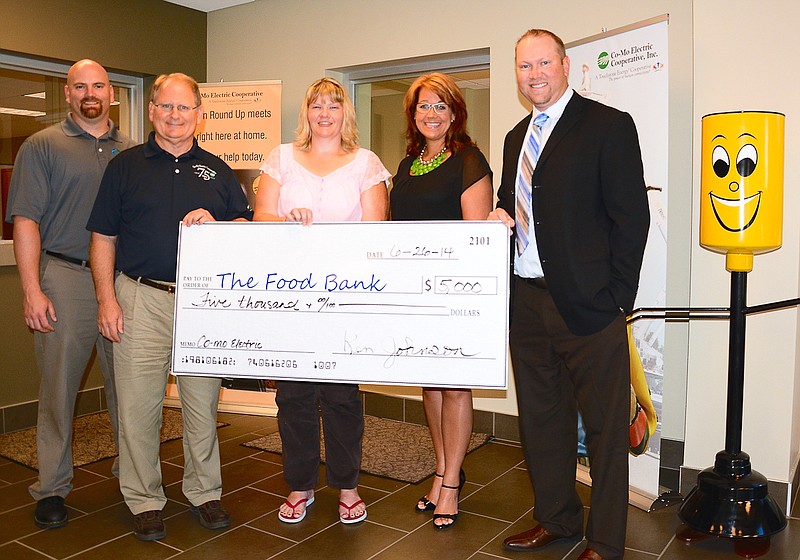 Co-Mo Electric Cooperative recently passed along a $5,000 grant to the Food Bank for Central and Northeast Missouri's Buddy Pack program. At the grant presentation June 26, from left, are Finance Manager Sean Friend, CEO/General Manager Ken Johnson, Co-Mo Food Bank Project Coordinator Rachel Thowe, Food Bank Southern Regional Coordinator Betsy Dudenhoeffer, and CoBank Vice President Seth Hart.
