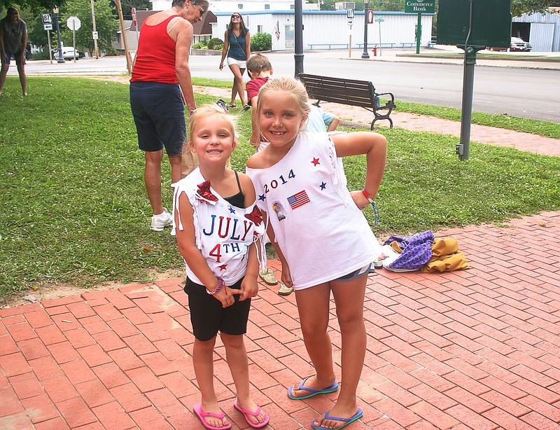 From left are friends Rhilynn McArthur, 5, and Kadence Kiesling, 8, enjoying the games for children on the courthouse lawn Friday following the annual July 4th parade in California. 
